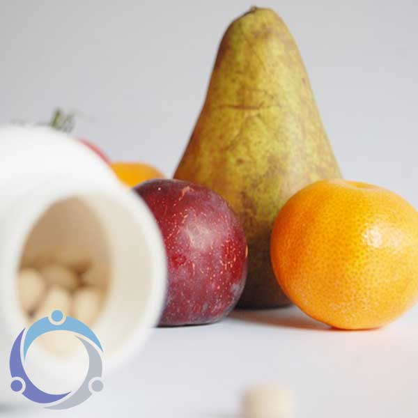As supplements are out of focus in this image, the fruits are highlighted showing there is a hidden healing power of food.