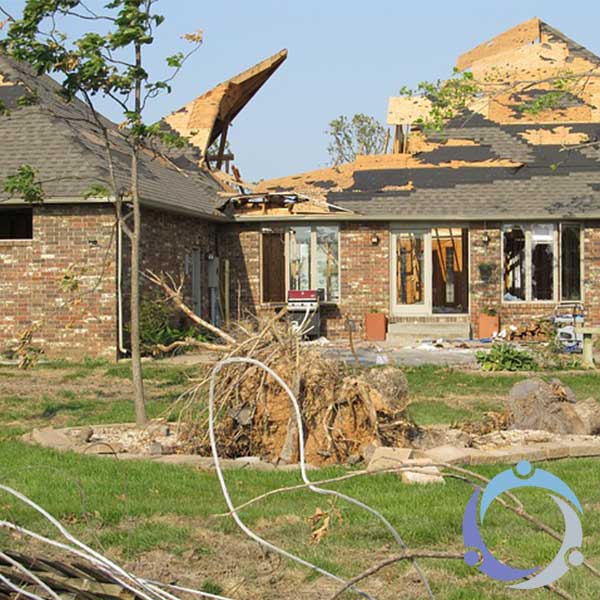 This image shows a house after a natural disaster, which the family could use the help of a disaster response team to help rebuild.